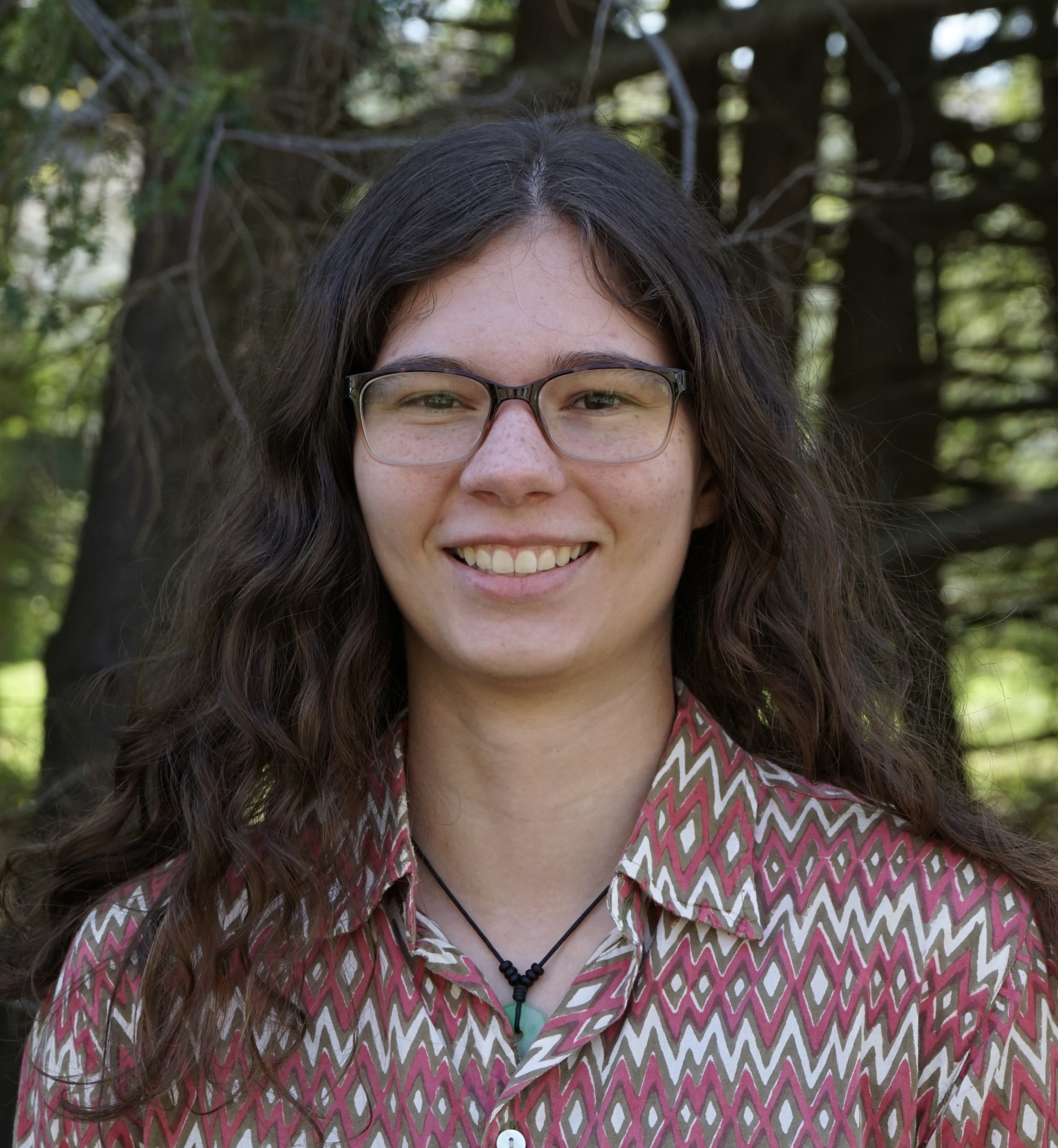 women with dark hair wearing glasses