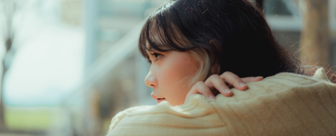 young girl woman looking into distance solemn thinking inquisitive