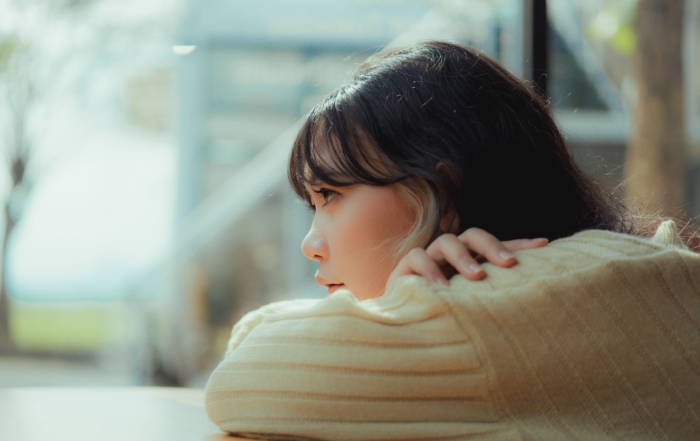young girl woman looking into distance solemn thinking inquisitive
