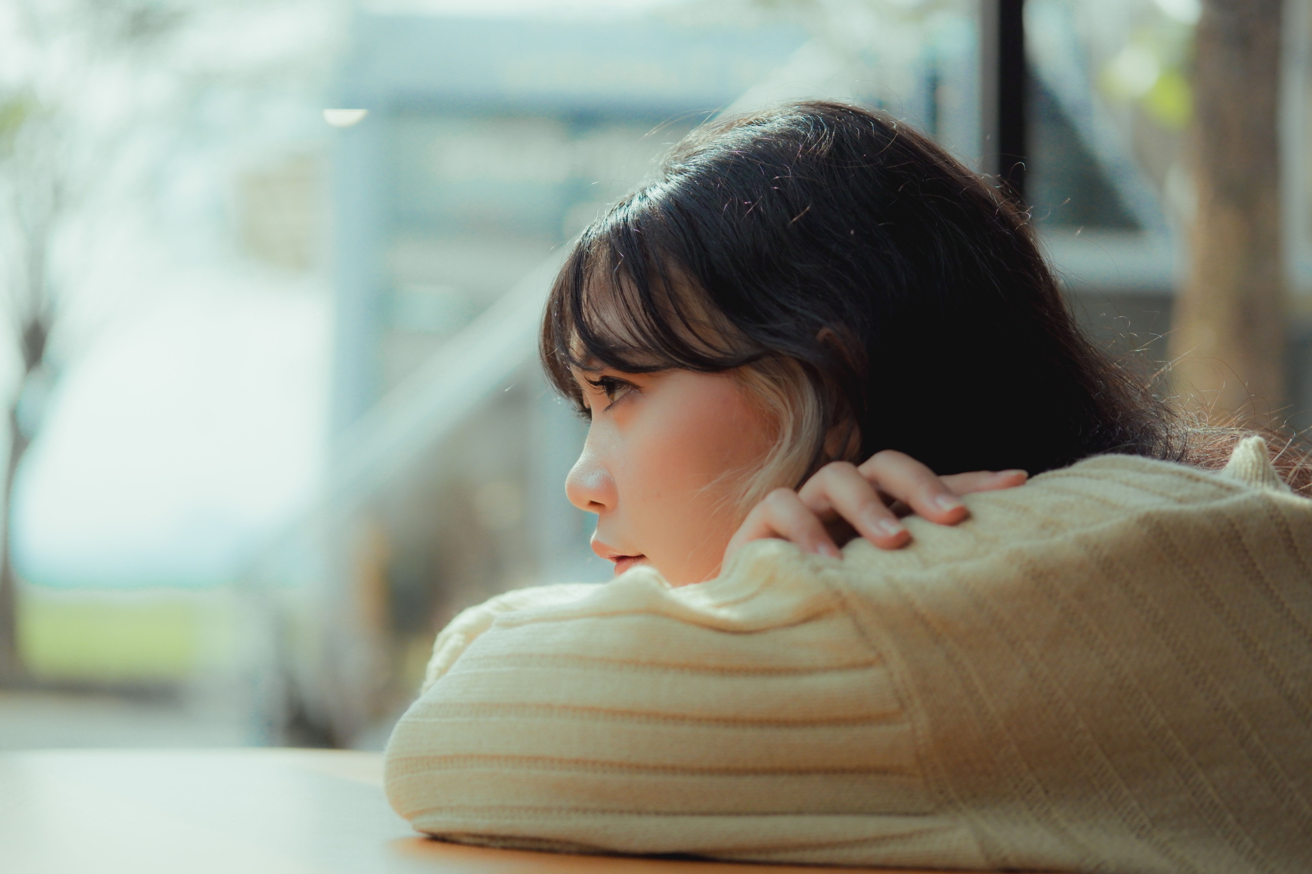 young girl woman looking into distance solemn thinking inquisitive