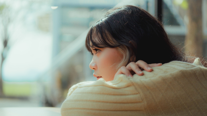 young girl woman looking into distance solemn thinking inquisitive
